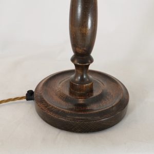 Close up of turned oak lamp base