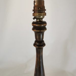 Close up of top of turned oak lamp